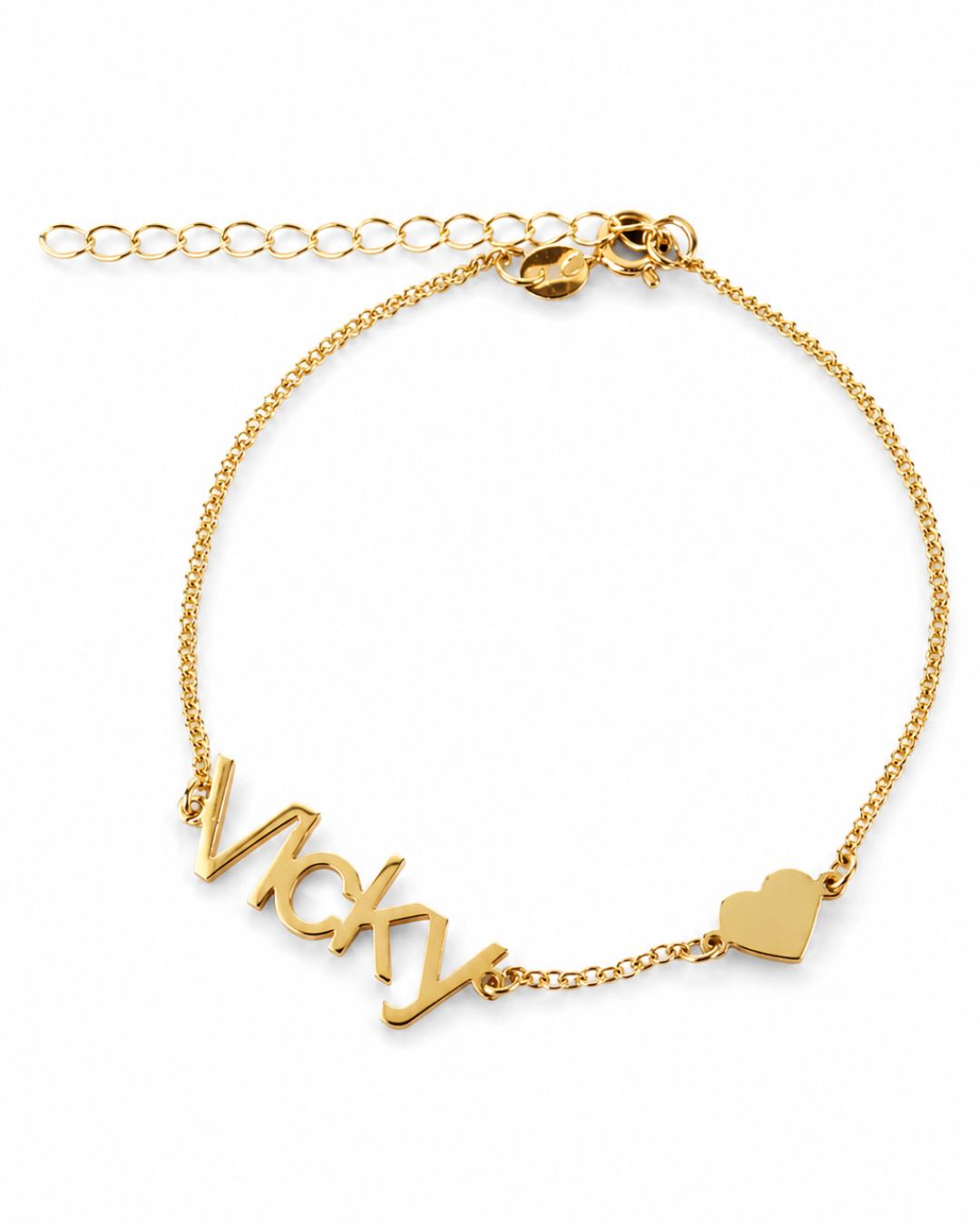 Gold-finish Fidji Love personalised bracelet with “Vicky” lettering, a small heart and an extension chain on a white background.