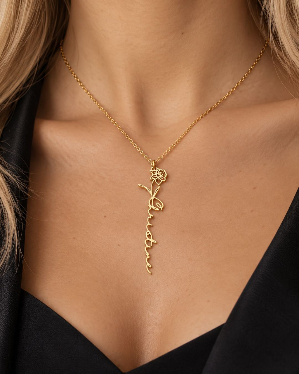 GIVERNY gold-tone personalised birth flower necklace worn by a blonde woman in a black outfit