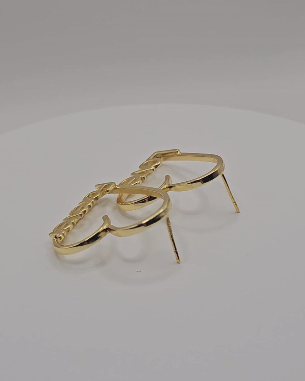 Love Story personalised heart earrings in a gold finish, featuring “Love” and “Forever” lettering.