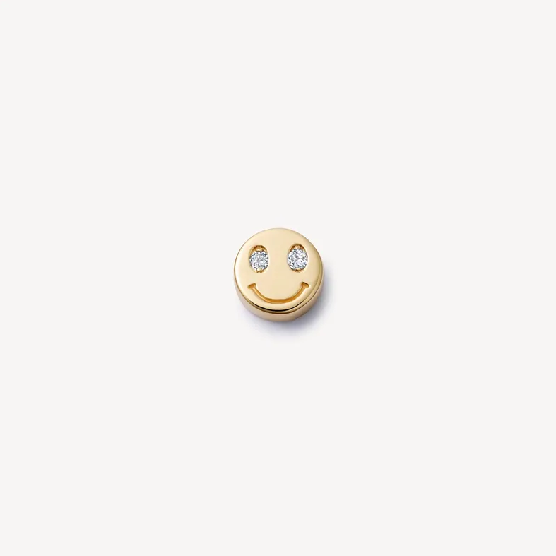 Gold-tone Smiley floating charm with a smiling face and two sparkling eyes for a Remember locket.